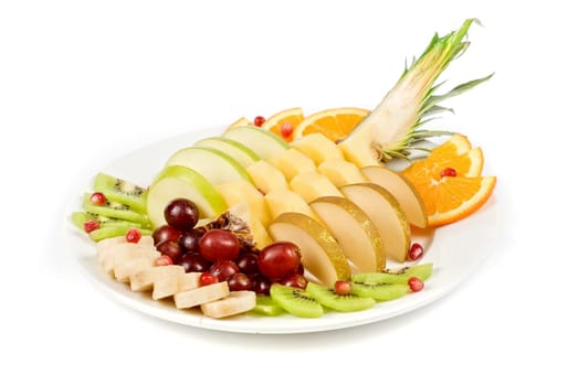 Fruit assortment closeup at plate on a white background