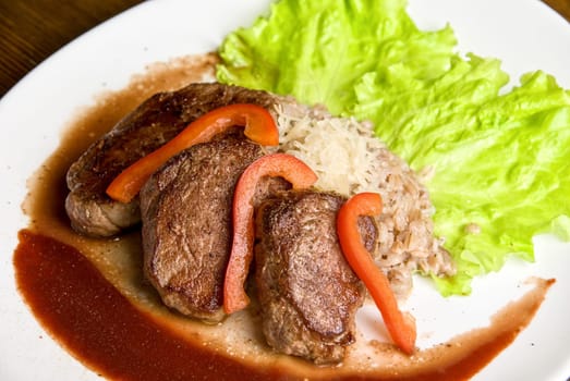 Roast maral meat with blood and garnish pearl barley - very tasty dish
