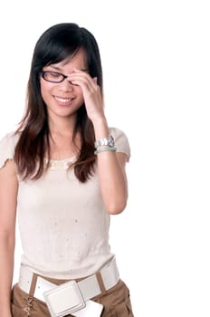 A shy girl in glasses is smiling with eyes closed isolated on white