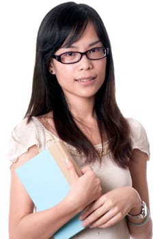 A young asian female holding a blue book while wearing glasses