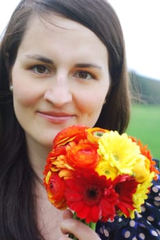 Young woman with gerberas