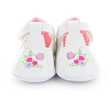 Closeup of girl baby shoes isolated on white background