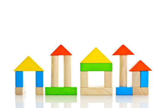 Buildings constructed out of toy wooden building blocks
