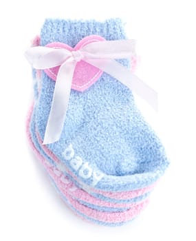 Pink and blue infant socks for baby shower with ribbon