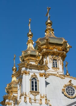 Golden dome church on background blue sky
