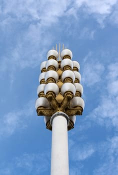 Lamp post on background sky, golden candelabrums