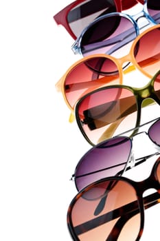 Different styles of tinted sunglasses on white background