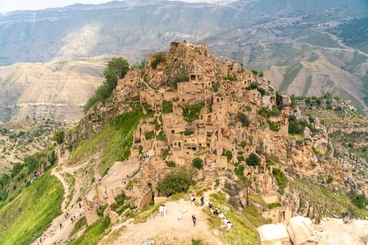 Dagestan Gamsutl. Ancient ghost town of Gamsutl old stone houses in abandoned Gamsutl mountain village in Dagestan, Abandoned etnic aul, summer landscape