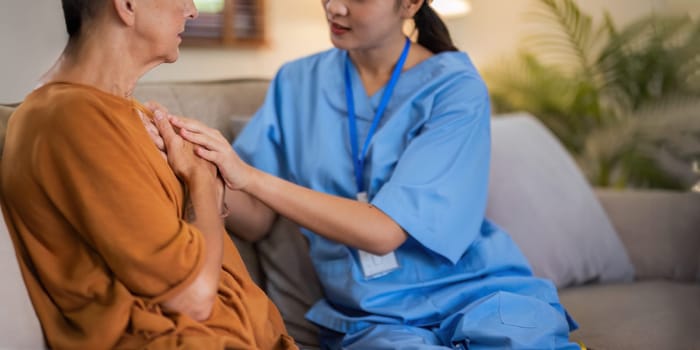 Empathy, trust and nurse caregiver holding hands with patient. consulting support and healthcare advice. Kindness, counseling and medical therapy in nursing home for hope, consultation and psychology.