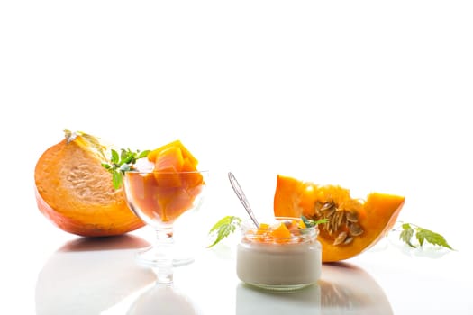 Homemade yogurt with pieces of pumpkin marmalade. Autumn recipes.