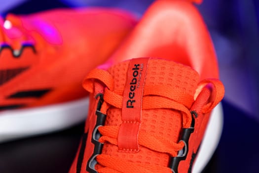 Tyumen, Russia-August 03, 2023: Stylish Red Reebok sneakers for running. Model Nanoflex TR 2.0