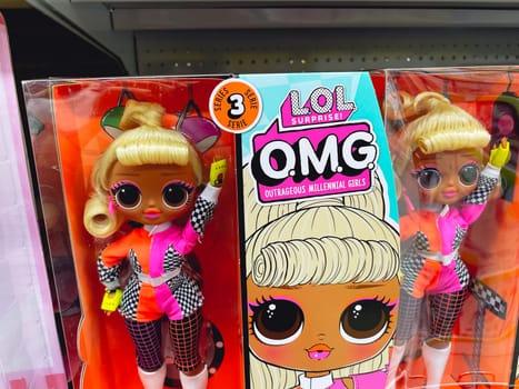 Tyumen, Russia-August 14, 2023: OMG and LOL dolls on shelves of toy story. Popular dolls for girls.