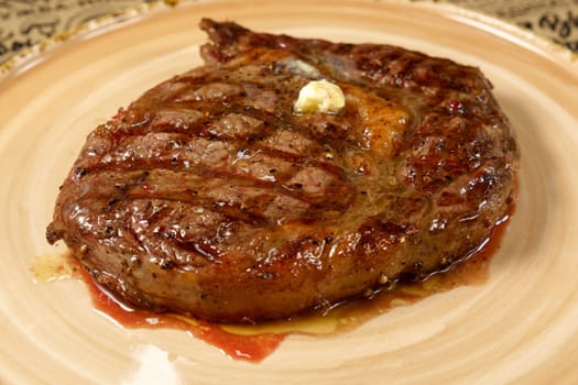 Plate with fresh grilled meat, juicy steaks. Close up. Selective focus