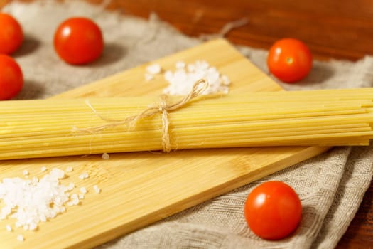 Pasta view of dy authentic Italian spaghetti, cooking with cherry tomatoes