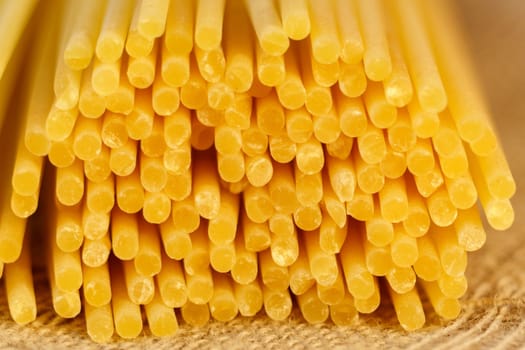 Italian Spaghetti pasta raw food background or texture close up. Selective focus