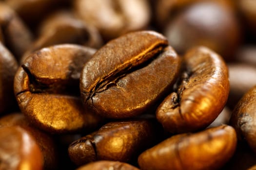 Roasted coffee beans, on a dark background. Espresso dark, aroma, black caffeine drink. Close up