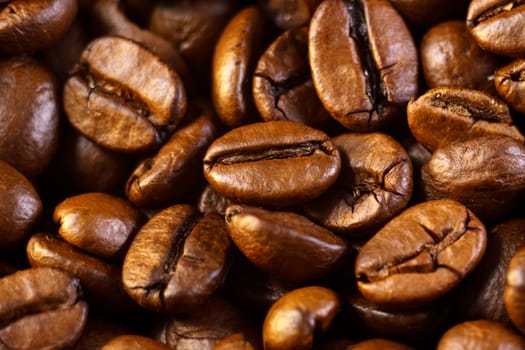 Dark brown roasted coffee is spinning. Coffee product advertising concept. Close up, macro. Selective Focus.