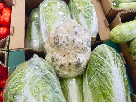 Tainted cauliflower. Black mold on bad cauliflower. Improper storage of vegetables.