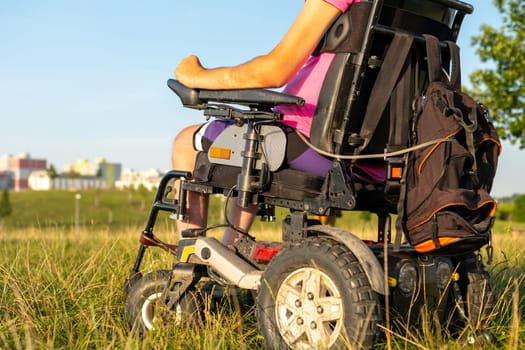 Close up a disabled man on a wheelchair in the park.