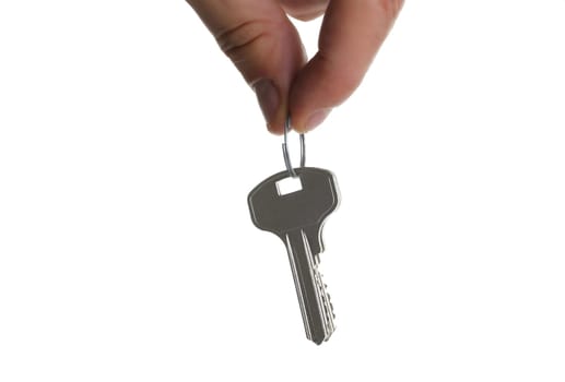 A male hand holds a metal bunch of keys from the apartment door isolated on a white background
