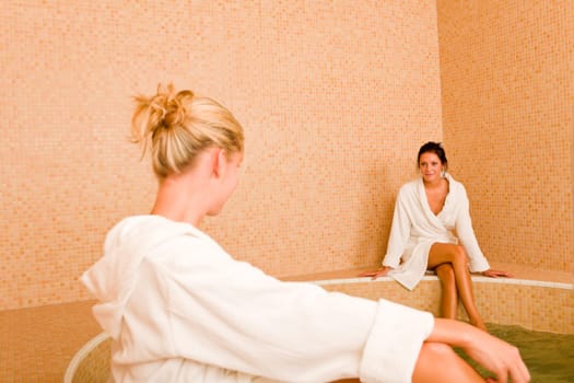 Relax bath healthy spa two beauty woman sitting bathrobe pool