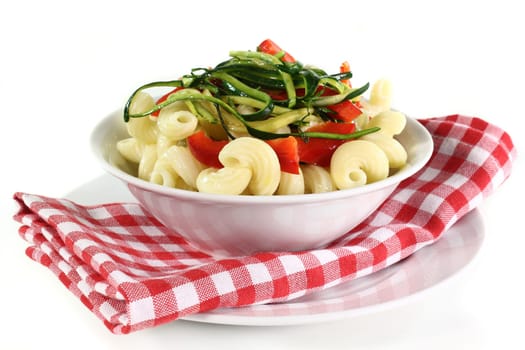a white bowl with a vegetarian pasta dish