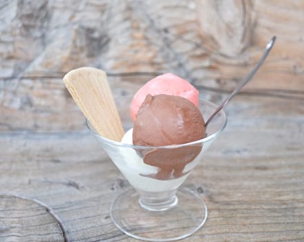 Chocolate and strawberry ice cream in a glass cup