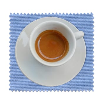 A cup of coffee over a blue tablecloth