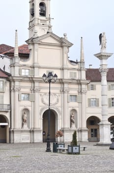 Piazza dell Annunziata square in Venaria Reale with Nativita di Maria church, Turin, Italy