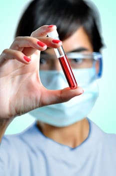 Woman looking at a blood sample
