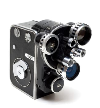Old movie camera 16 mm with three lenses on white background