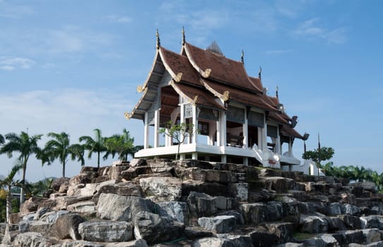 Chinese palace on stone on background blue sky