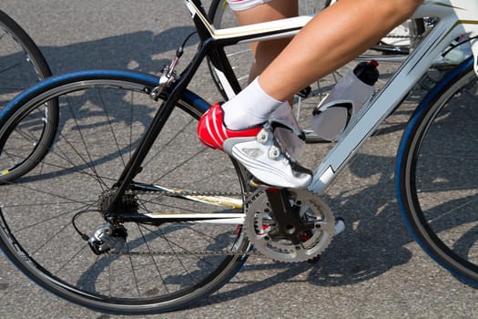 The cyclists riding by at the bicycle race