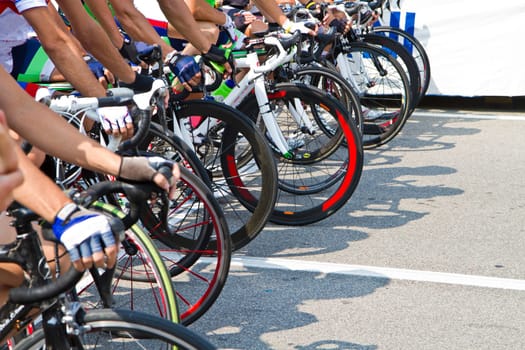 The cyclists riding by at the bicycle race