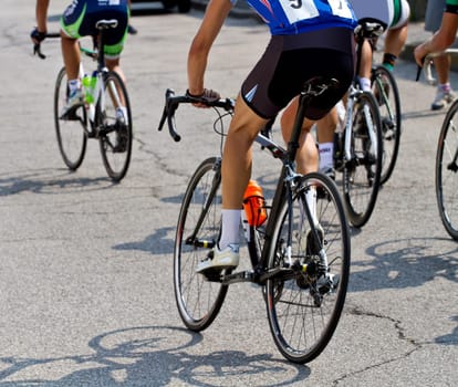 The cyclists riding by at the bicycle race