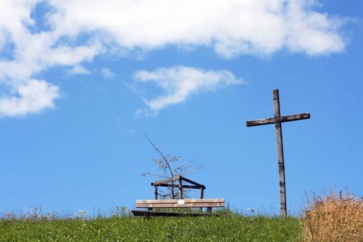 The bench under the cross