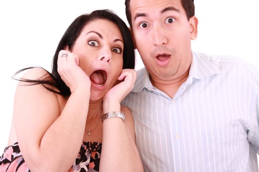 young adult couple in cinema movie theater scared while watching horror film.