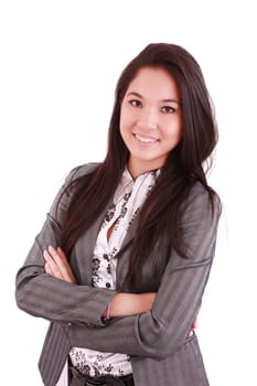 portrait of a happy young business woman standing with folded hand against white background