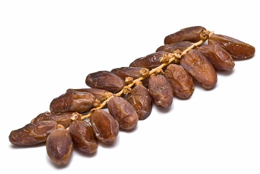 Date fruit isolated over a white background.