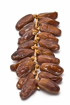Date fruit isolated over a white background.