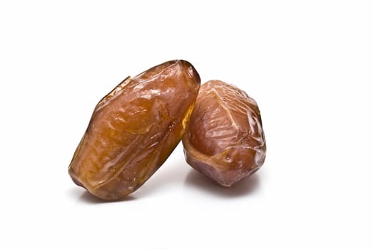 Date fruit isolated over a white background.