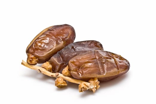 Date fruit isolated over a white background.