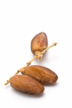 Date fruit isolated over a white background.