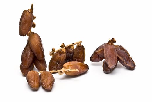 Date fruit isolated over a white background.
