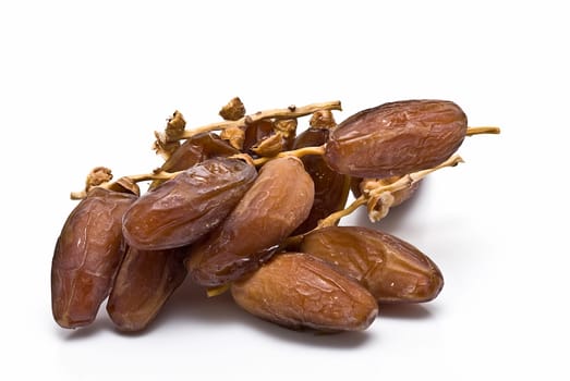 Date fruit isolated over a white background.
