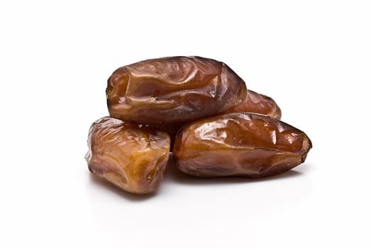 Date fruit isolated over a white background.