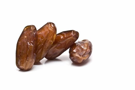 Date fruit isolated over a white background.