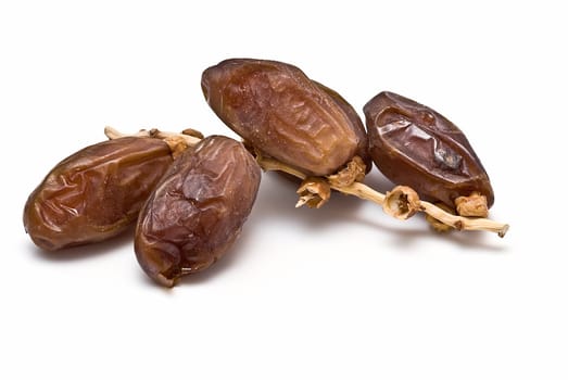 Date fruit isolated over a white background.
