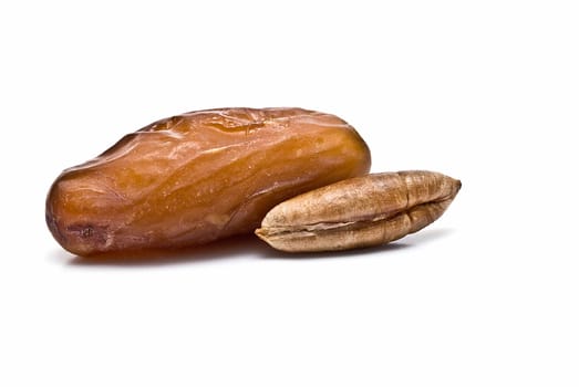Date fruit isolated over a white background.