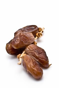 Date fruit isolated over a white background.